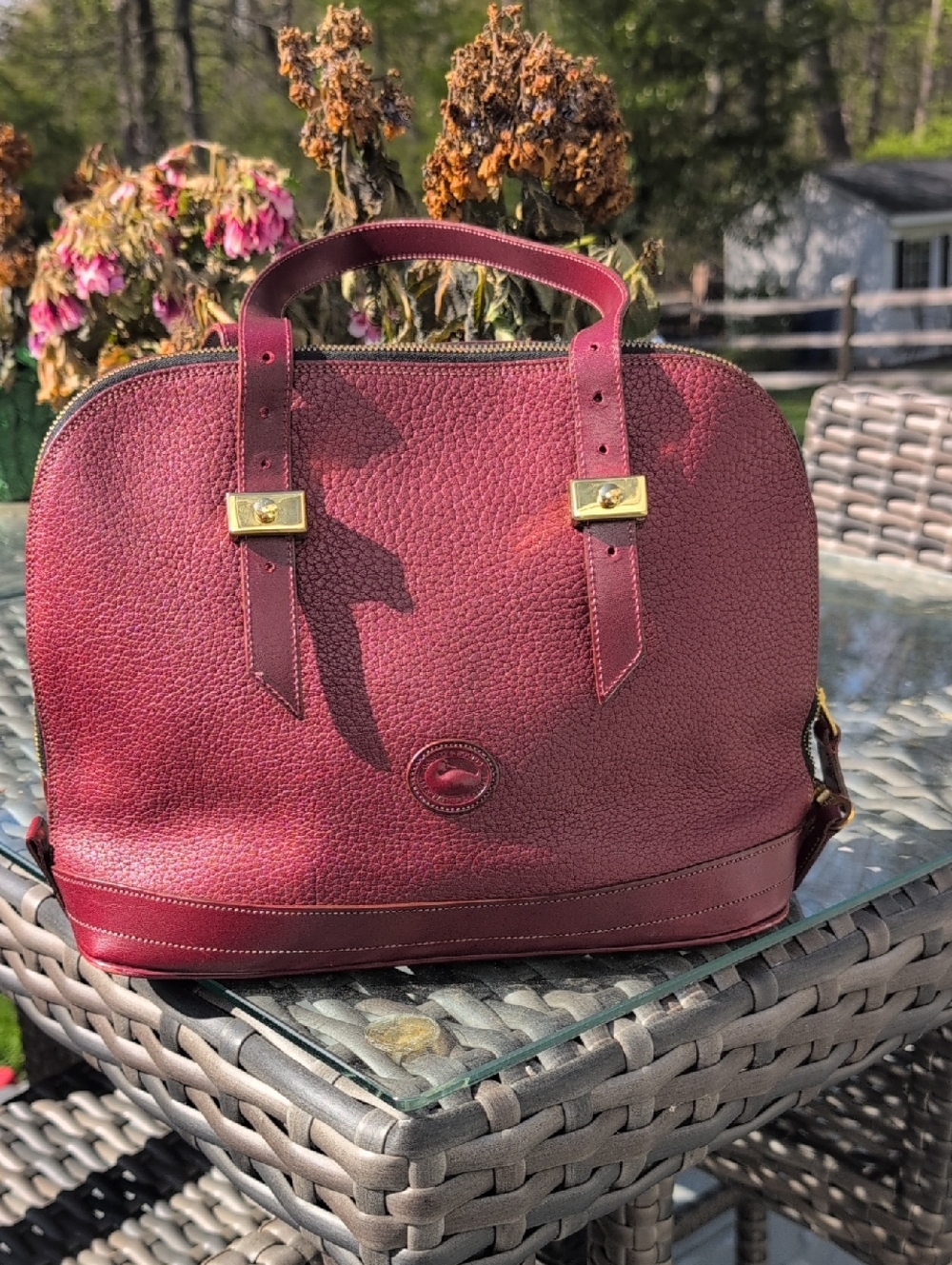 Dooney & Bourke Vintage Burgundy Leather Dome Satchel With Gold Hardware.